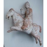 A Chinese Tang Dynasty pottery figure group of a horse with rider in full flight, 7" - a/f.