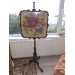 A Victorian mahogany tapestry pole screen on tripod base, Height 58".