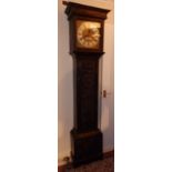A George III eight day striking carved oak longcase clock by George Hewett of Marlborough, the