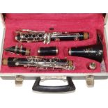 A cased Boosey & Hawkes Regent 300 clarinet, approximately 27".