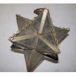 A brass framed Star of David glass panelled light shade, 11.5" across.