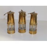 Three miniature brass miners' lamps - 'Vespers 1980 Colin & Gwen', 5" high.