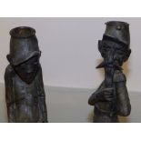 A pair of early 20thC spelter military caricature figures/candlesticks - possibly General Florentin,