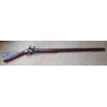 An antique flintlock musket , having East India Co. lock, 40" barrel, 55.5" overall.