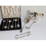 A cased set of six Birmingham silver teaspoons, a London sugar sifter, a sauceboat and two other