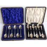 Two cased silver teaspoon sets. (12)