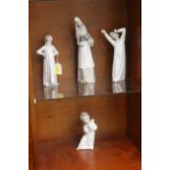 Three Nao figurines and a Lladro figurine