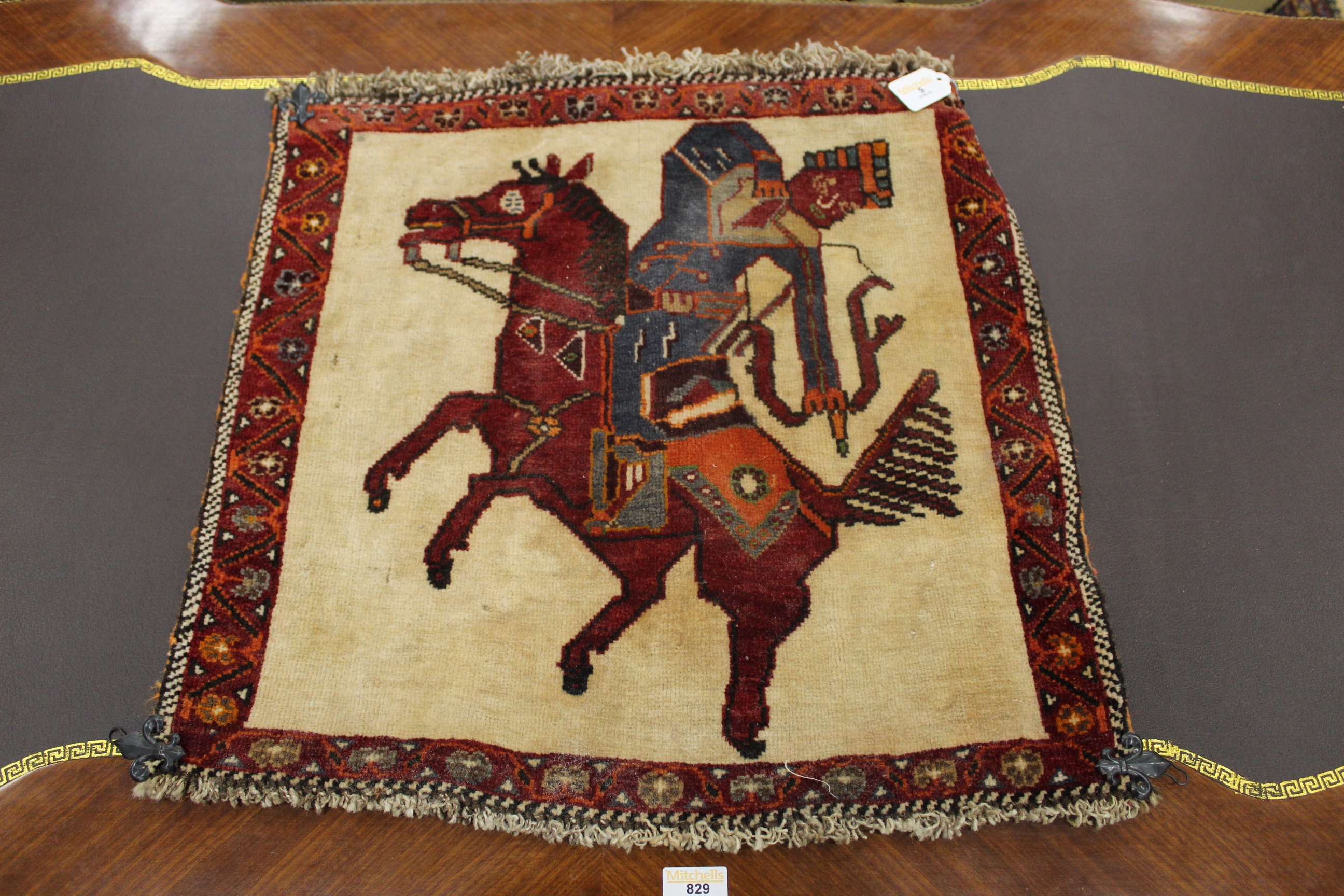 Wool wall hanging of a mounted archer 54 x 56 cm