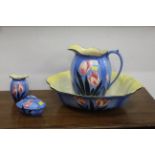 Four piece toiletry set, floral decoration on blue background, Falcon Ware Made in England.