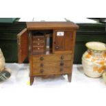 Miniature set of drawers with double doors above with built in mirror and drawers, width 26.