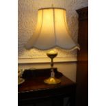 Brass effect table lamp and shade, 70 cm high.
