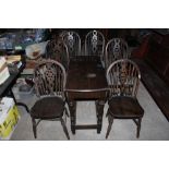 A set of four stained elm seated wheel b