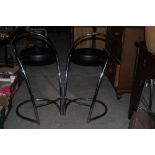 Two chromed bar stools, with leather eff