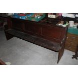A pitch pine church pew, of traditional