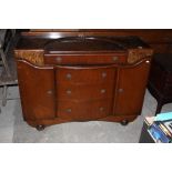 A 1940's oak bow fronted sideboard, the