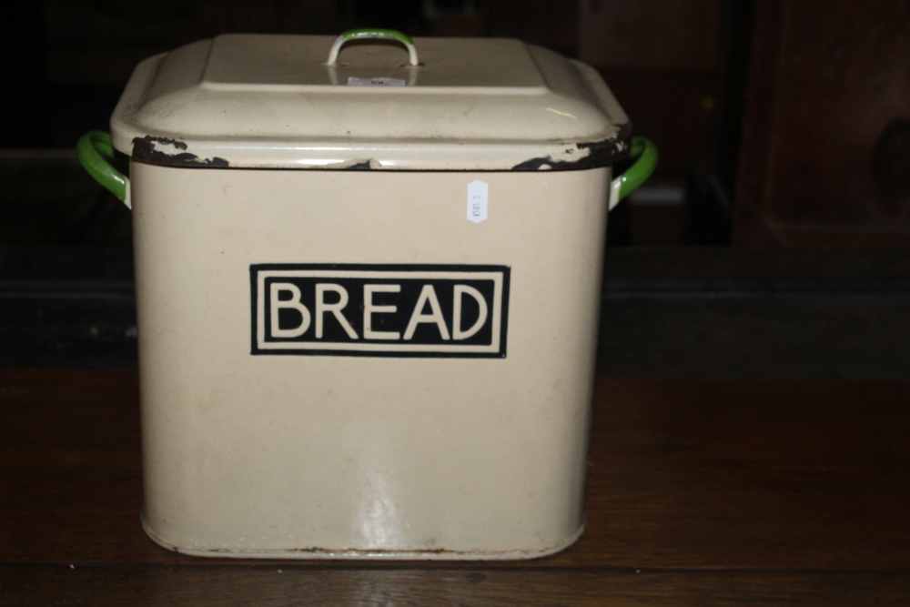 A vintage cream enamelled bread bin, of