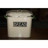 A vintage cream enamelled bread bin, of