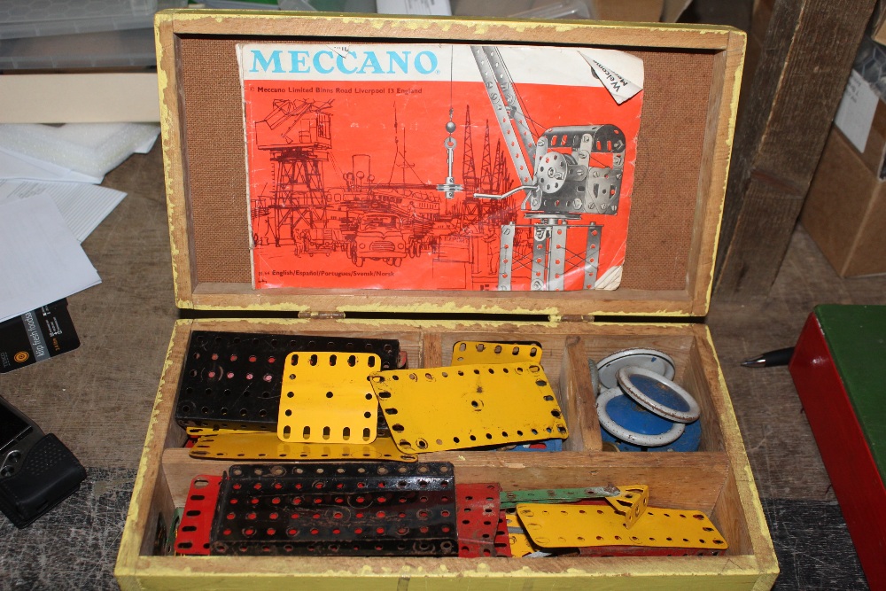 Two wooden painted chests containing Meccano.