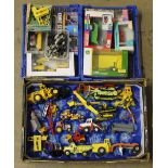 A group lot of boxed and unboxed diecast and plastic model construction vehicles, by John Deere,