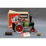 A boxed 1960's Mamod SR1 steam roller with burner and steering rod.