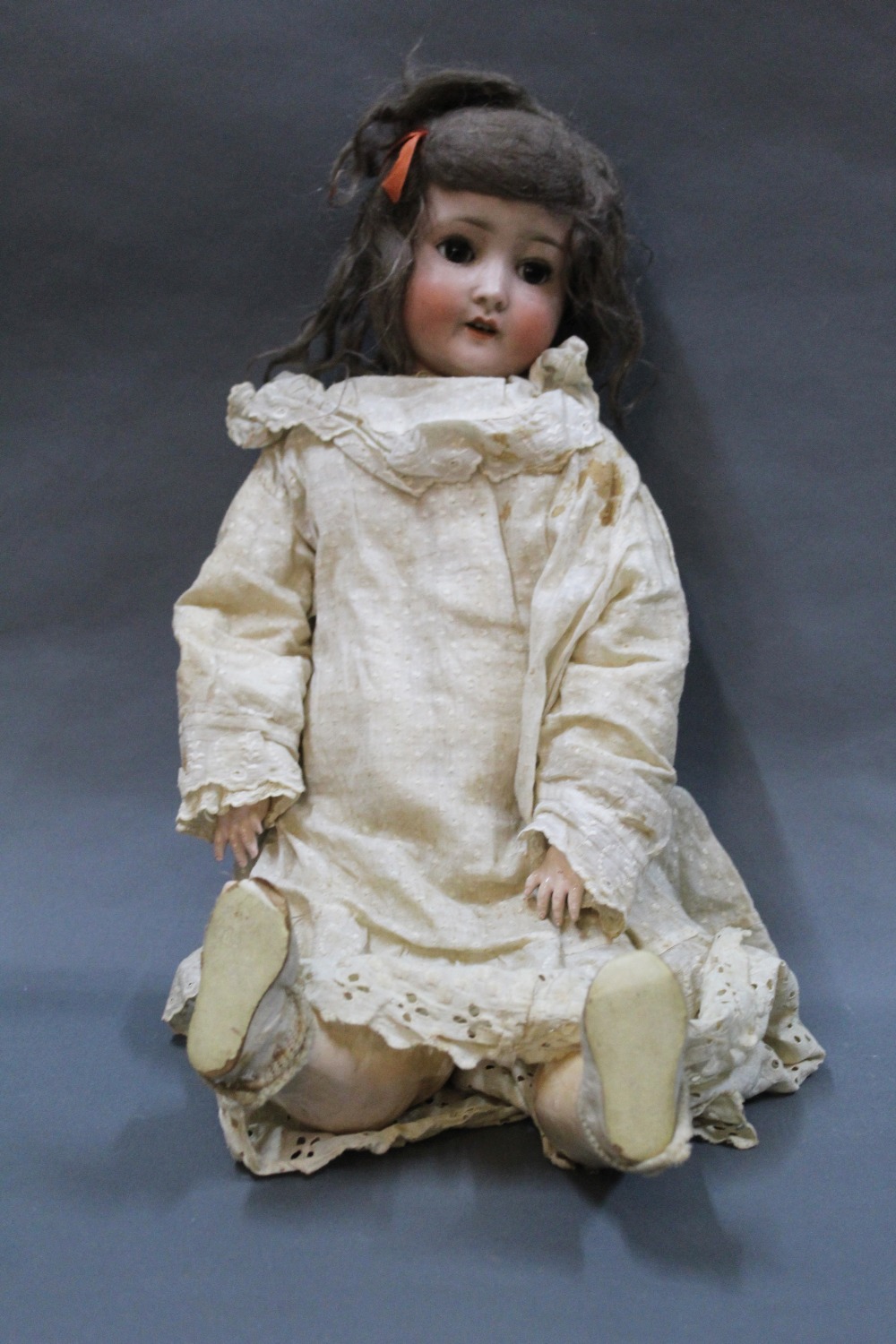 An early 20th century German bisque head Schoenau and Hoffmeister doll,