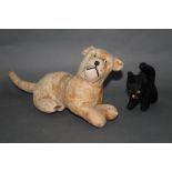 Two early to mid 20th century and wood wool filled cat soft toys, the largest measuring 45 cm long,