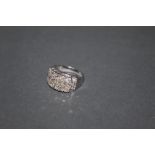 An 18ct white gold and diamond ring,