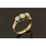 A 9ct gold and diamond engagement ring, illusion set with three small diamonds, ring size H.