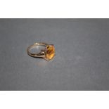 A 9ct gold and citrine set ring, the square faceted stone approx 3 carat, ring size N.