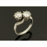 A Boodle & Dunthorne platinum and diamond set crossover ring,