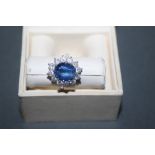 A 9ct white gold kyanite and diamond flower head ring,