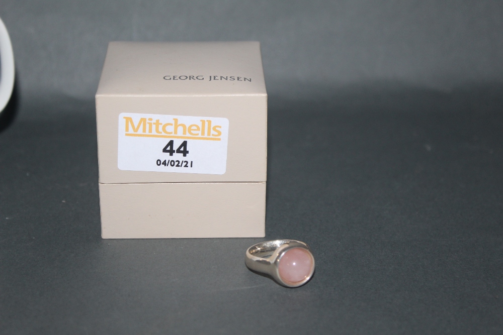 A George Jensen silver and rose quartz set ring with cabochon stone, design number 473,