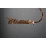 A Vivian Westwood gilt metal necklace of rope twist and tasselled design, with box the same.