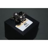 A George Jensen silver and black onyx moonlight grapes ring, marked G J 925S, ring size O.