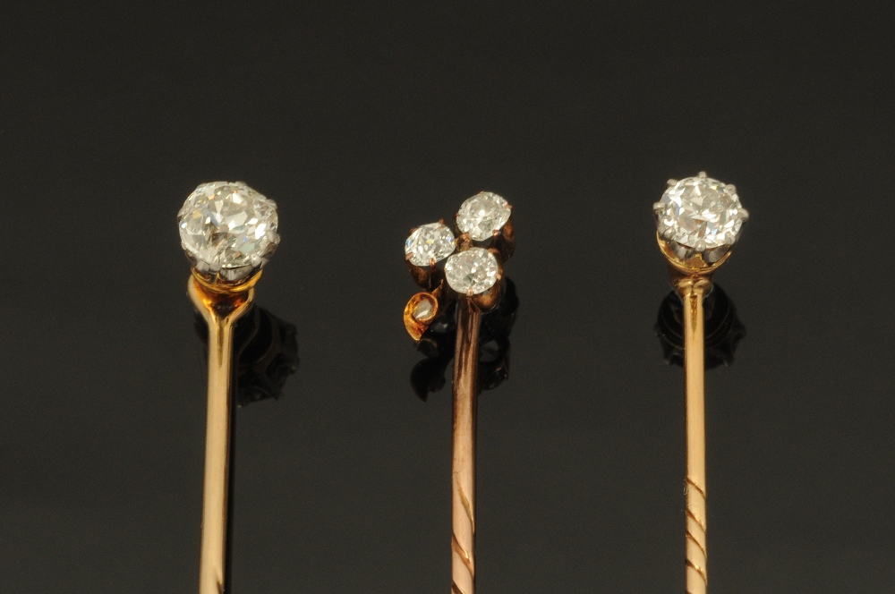 Three gold coloured metal and diamond set stick pins, two set with single stones (0.2 & 0. - Image 2 of 3