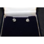 A pair of 18ct white gold and diamond cluster earrings,