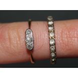 A gold coloured metal and white stone full eternity ring,