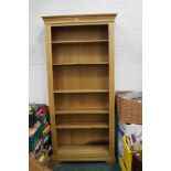 A modern oak freestanding bookcase with