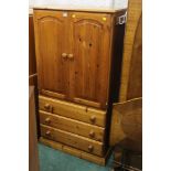 A modern pine cupboard with three drawer