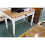 A painted pine table with central drawer