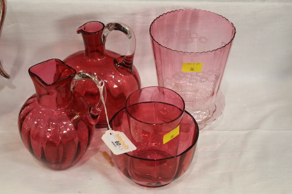 Five pieces of Cranberry glass, shade, 2 jugs,