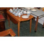 A lightwood drop leaf table, width exten