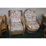 Two conservatory armchairs, one on a swi