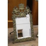 Bevelled edge rectangular mirror with ornate brass frame and easel back, 38 cm high,