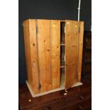 A rustic pine cabinet, fitted two shelve