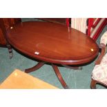 A modern oval mahogany occasional table