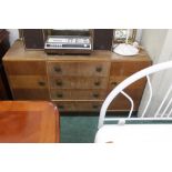 A 1950's oak sideboard with four central
