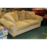 A gold three seater settee