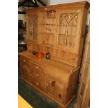 A pine glazed dresser with five drawers