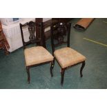 A pair of Edwardian splat back dining ch